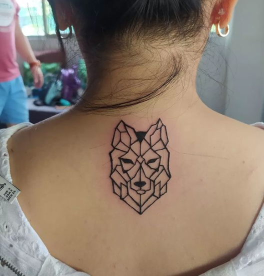 Geometric Alpha Wolf Tattoo on Back