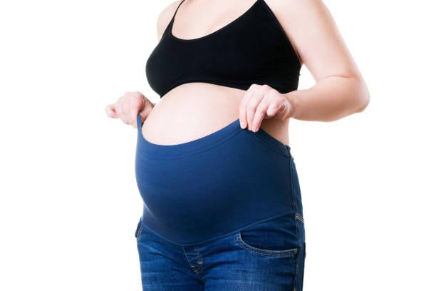 Clothes For Pregnant Women Blue Jeans With High Waist Isolated On White  Background Stock Photo - Download Image Now - iStock