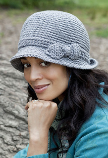 woman wearing a gray crochet cloche