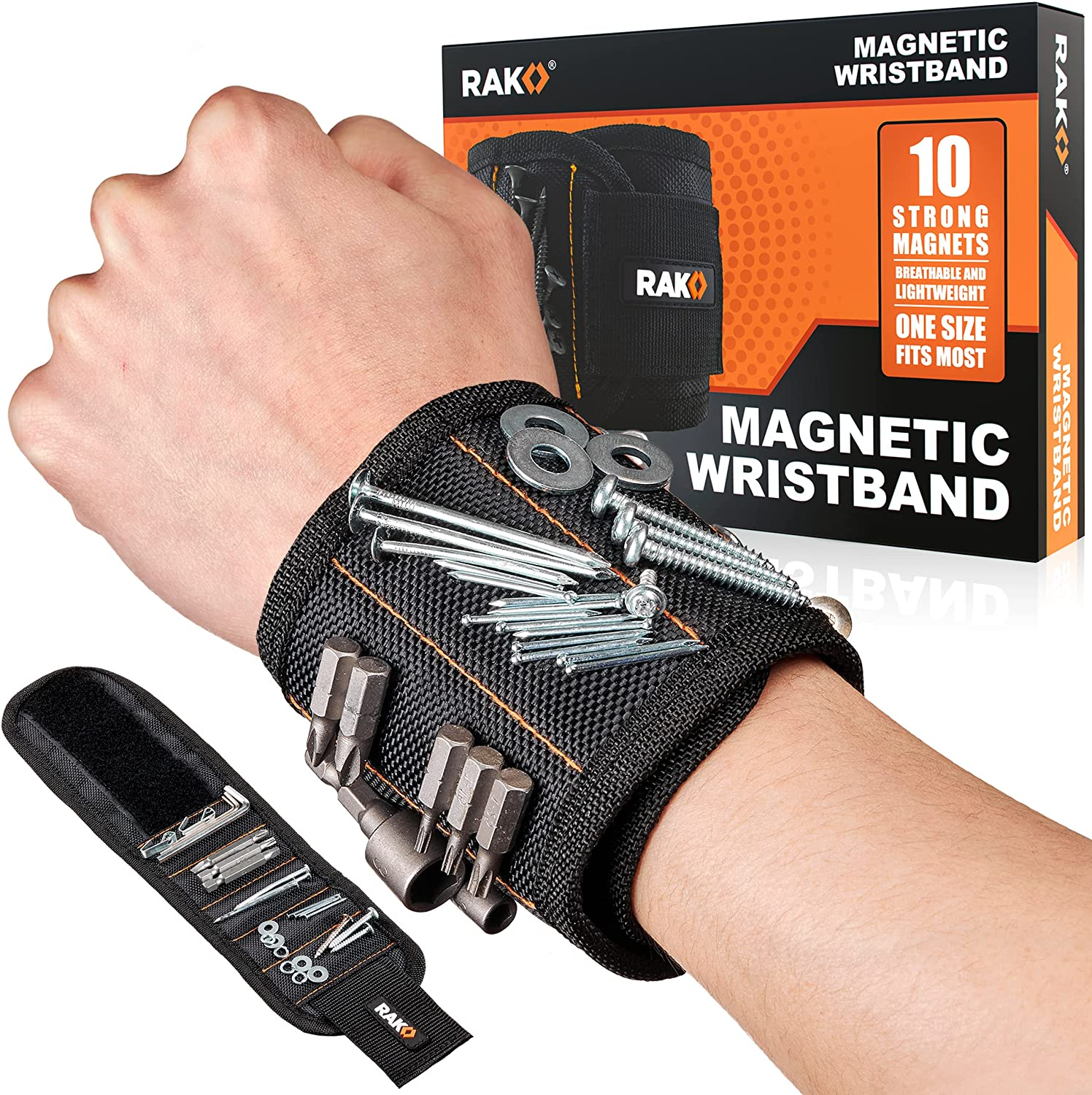 A wrist with a black magnetic wristband holding screws, nails, and washers with another wristband and its box in the background.