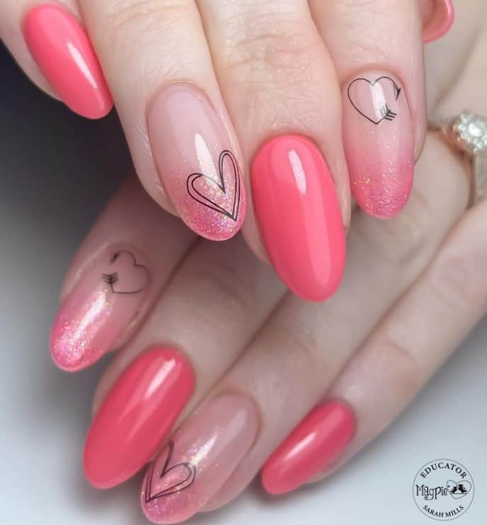 Full picture showing statement heart on pink nails