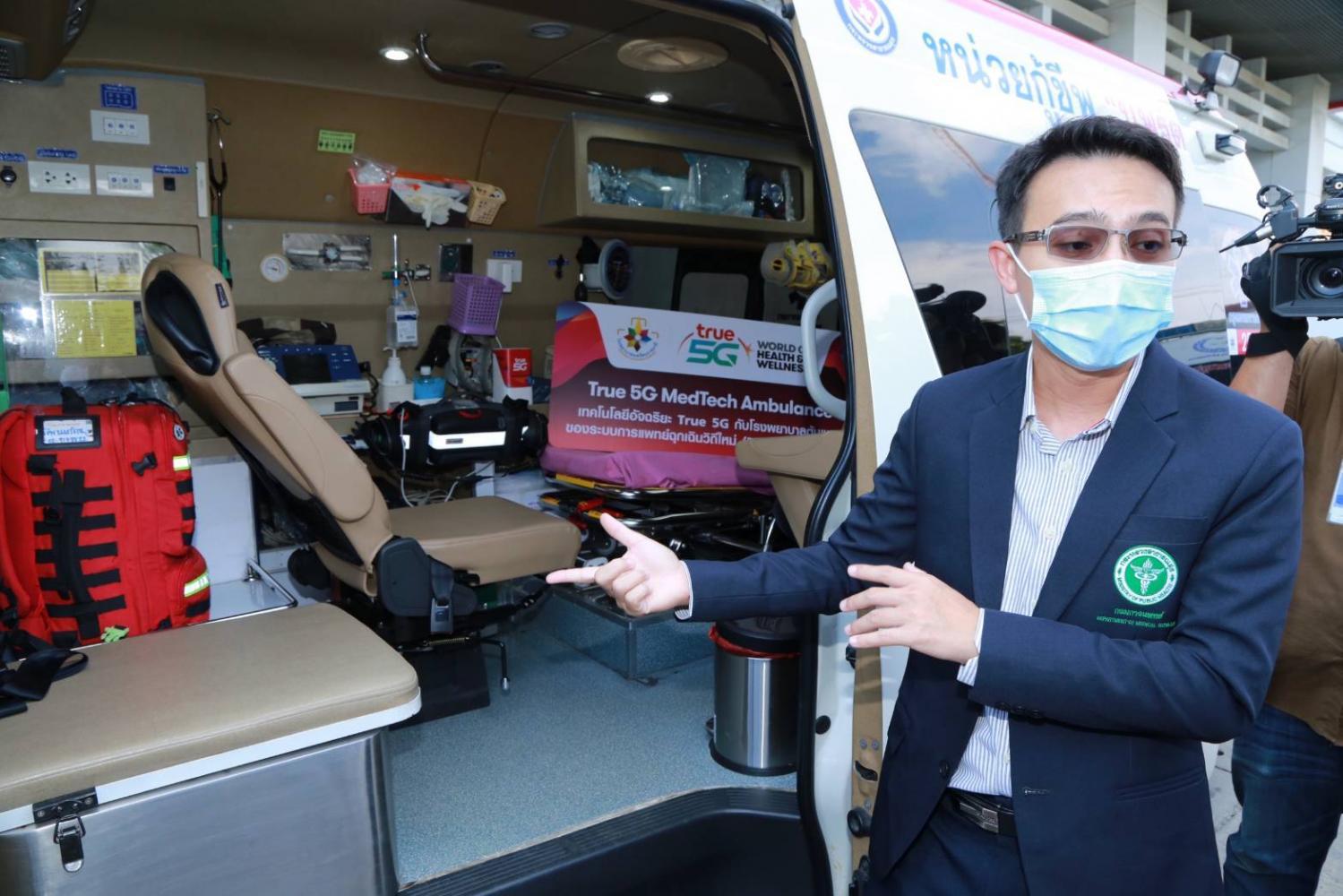 Chalermpon Chairat, chief of the emergency unit at Nopparat Rajathanee Hospital, demonstrates a smart ambulance equipped with 5G.