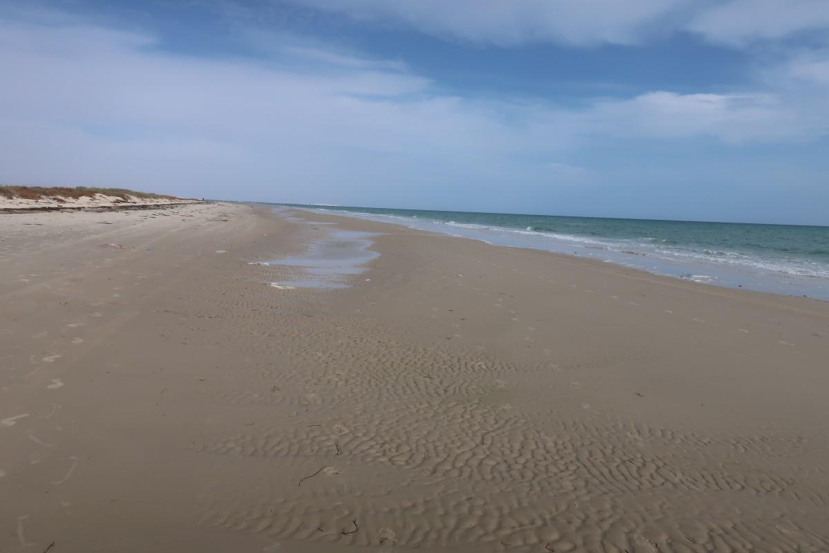 sea, sky, water, beach, ocean, sun, blue, horizon, sunset, nature, body of water, sand, shore, coast, natural environment, wave, coastal and oceanic landforms, wind wave, calm, waterway, vacation, tide, cloud, tropics, bay, shoal, landscape, mudflat, caribbean, channel, aeolian landform