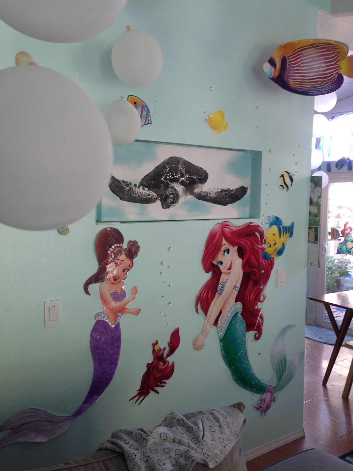 another wall of decorations of Ariel and one of her sisters. 
