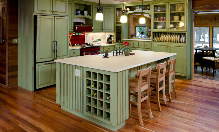 A wine rack on the side of a kitchen island