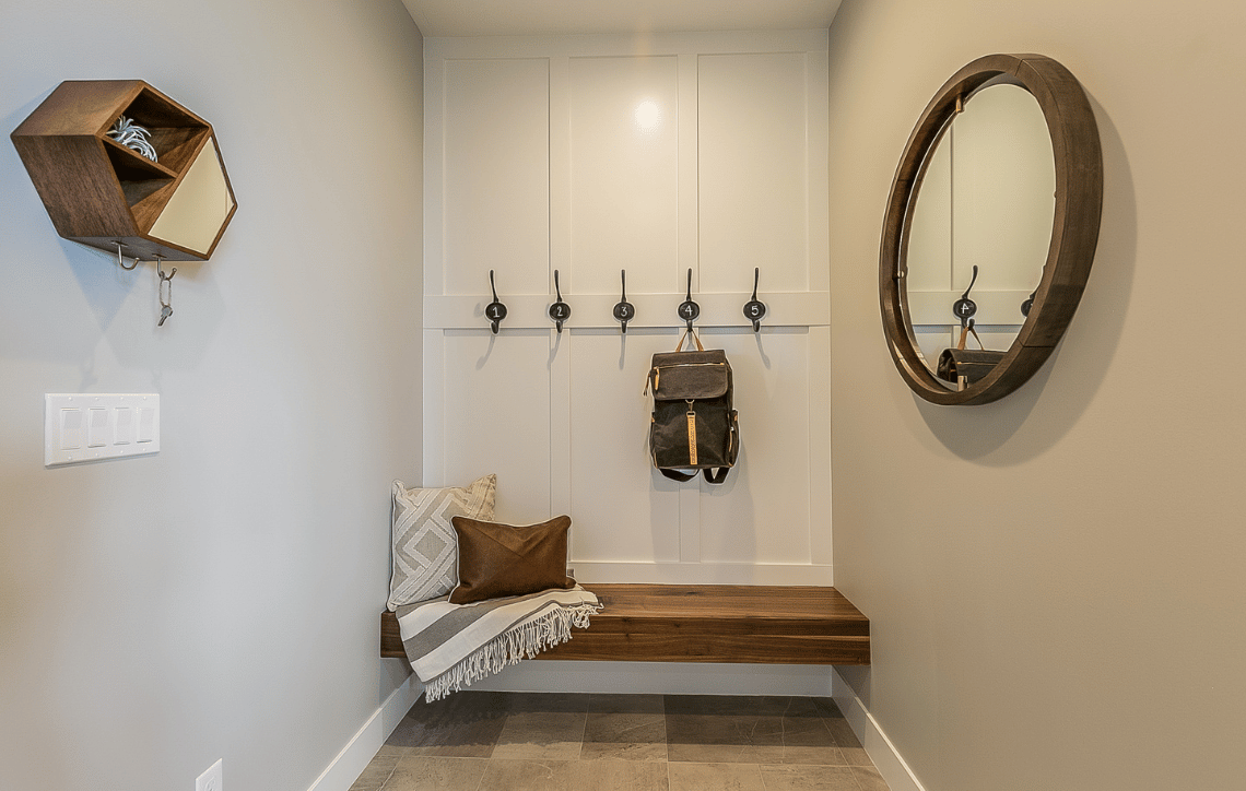 Clean mudroom with a bench and coat hanger