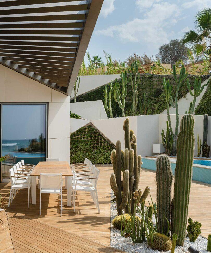 Art Collector's Villa With an Angular Green Roof + Triangular Pool