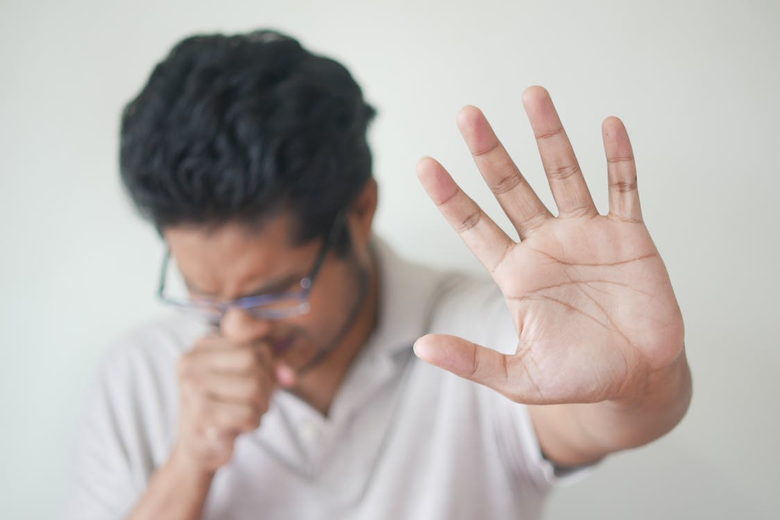 Free Selective Focus Photo of Coughing Man's Hand Stock Photo