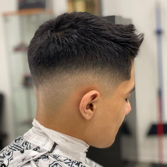 man wearing a mid fade with short hair