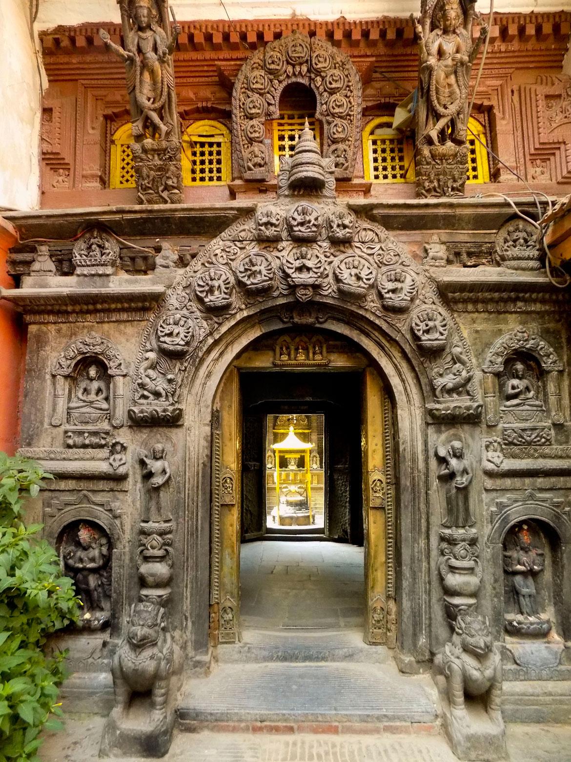 The bigger courtyards are, of course, the ones that are home to the big monasteries or bahas. These are entirely religious spaces, with multiple shrines and temples enclosed within. This is the ornate entrance to the biggest monastery in Patan, the Kwa Baha. Its Sanskrit name is Hiranyavarna Mahavihar, and its popularly known to tourists as the Golden Temple