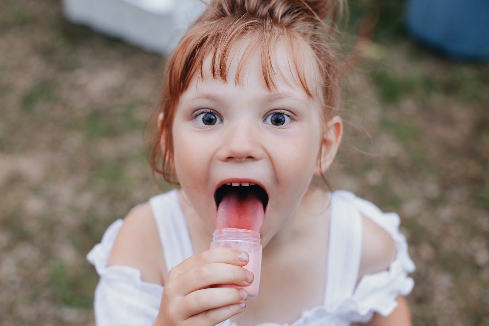 child licking candy