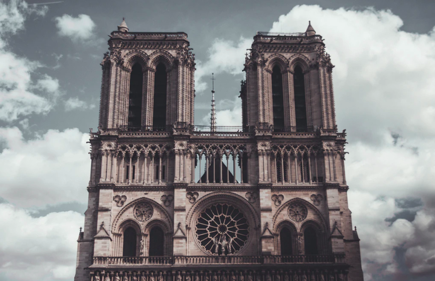 Cathedral Notre Dame de Paris surrounded by clouds