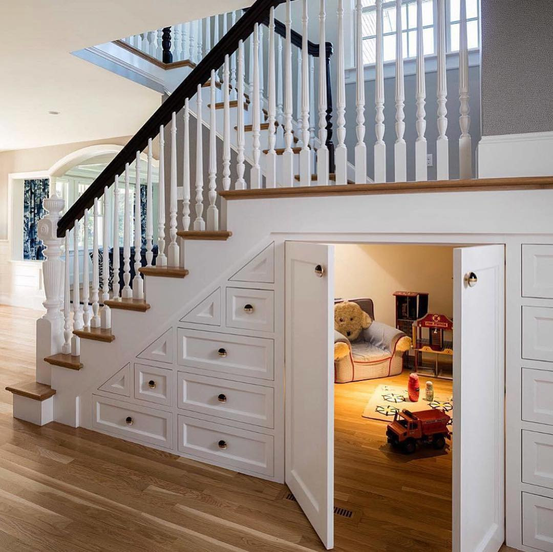 Large kids' playroom under the stairs 