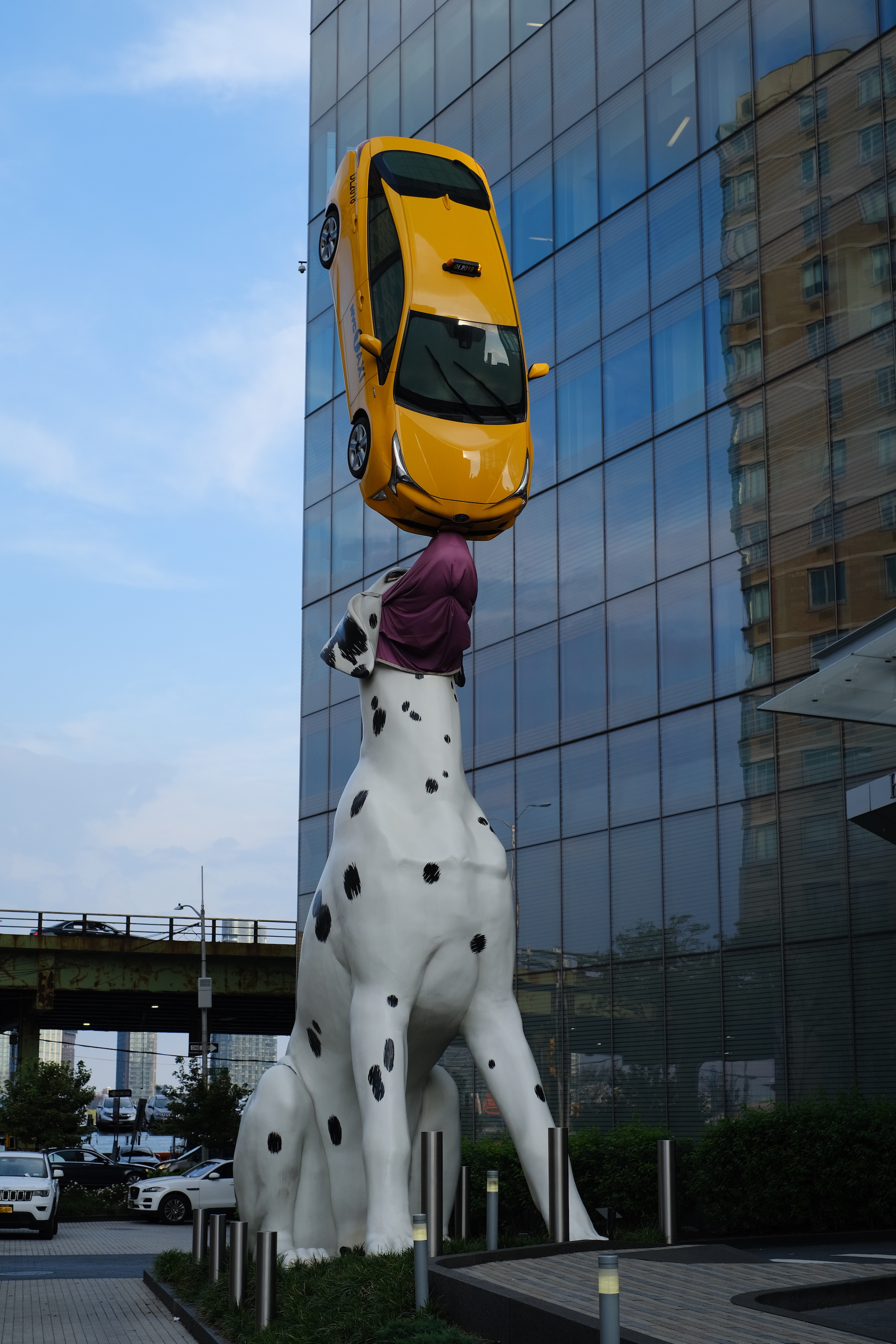 Sculpture of a dog and a taxi