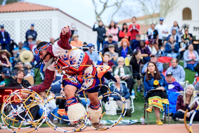 Spectators look on as a dancer competes in the 2020 World Championship Hoop Dance Contest at Heard Museum in Phoenix, Arizona. 