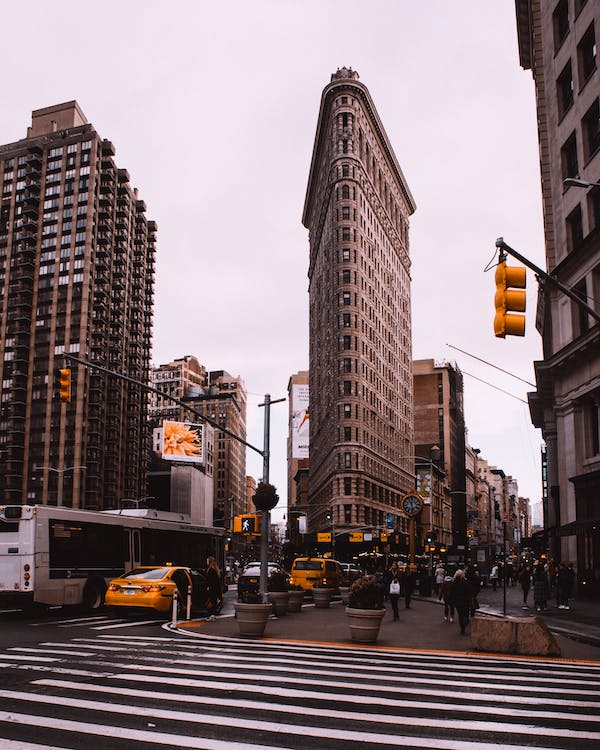 Traffic lights at a busy street with a lot of traffic