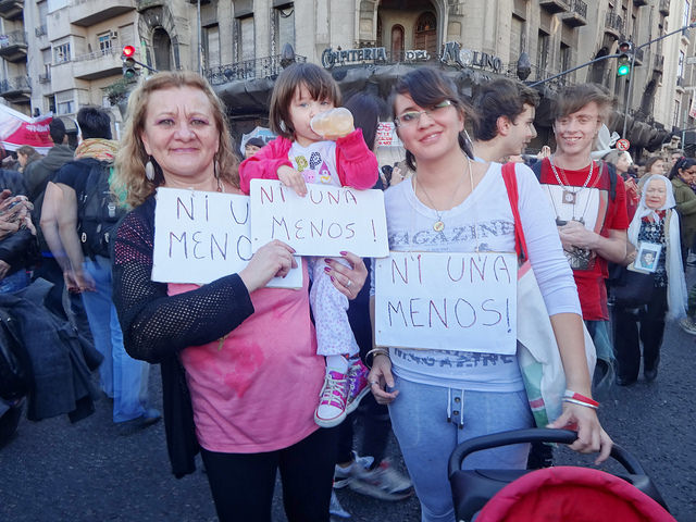 Soraima Torres, her daughter Mariela and her granddaughter, three generations of Argentine women, hold up signs with the slogan “Ni Una Menos”, in the demonstration against femicide in Buenos Aires. Credit: Fabiana Frayssinet/IPS
