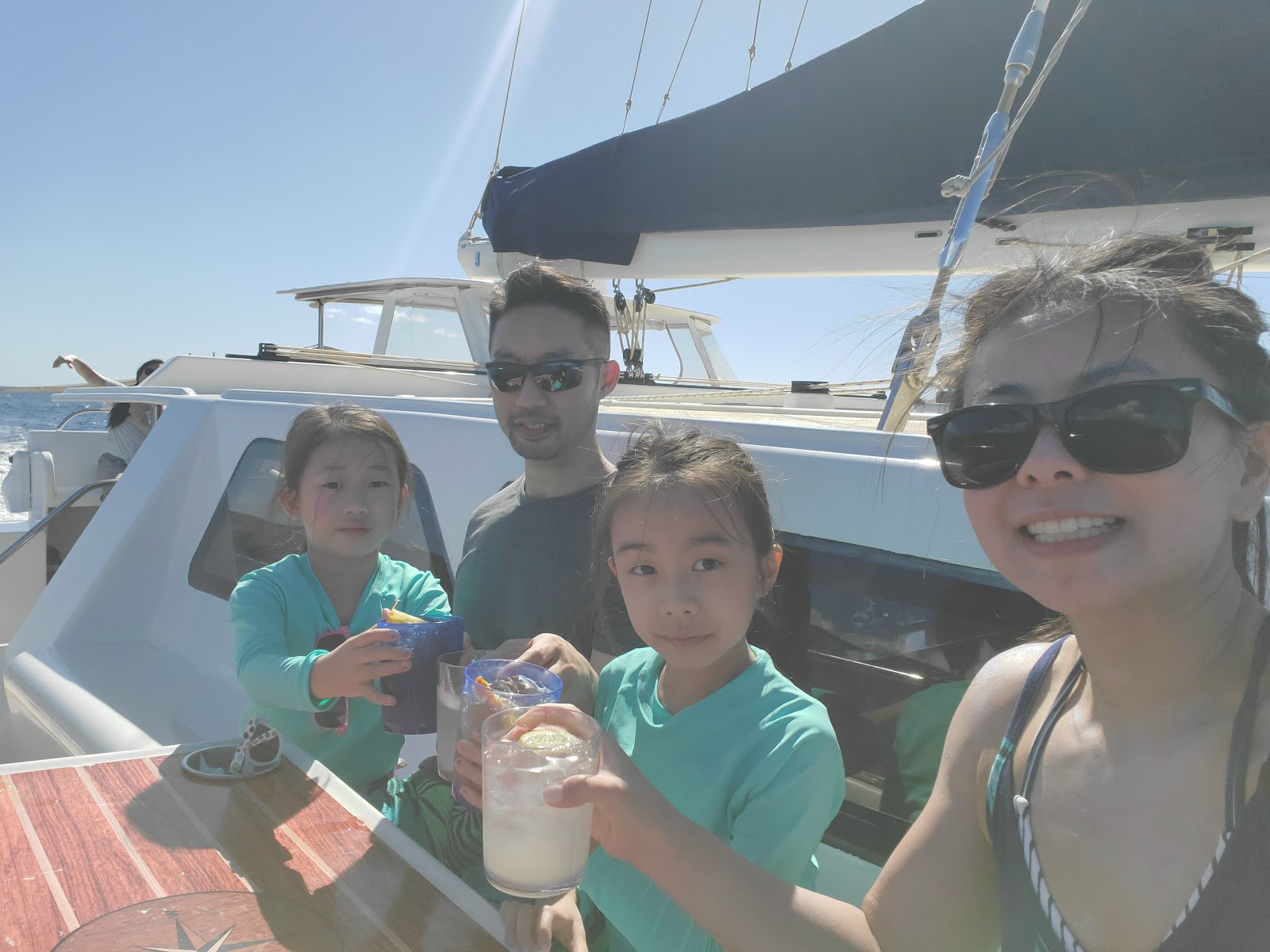 Image of a family taking a selfie on a Maui boat ride