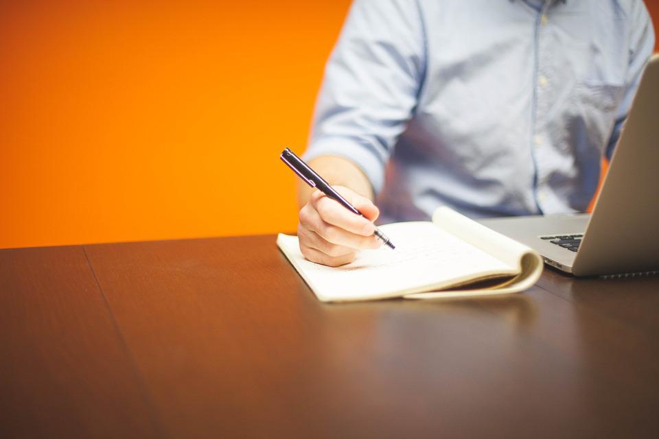 a man taking notes