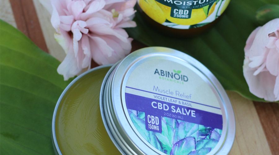 CBD salve next to leaves