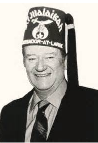 A photograph of John Wayne in his Shriner’s cap