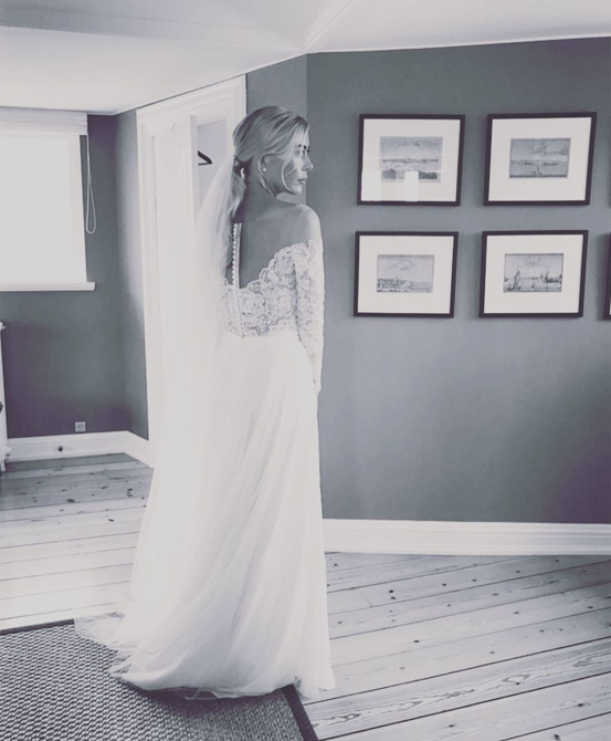  Louise pictured on her wedding day wearing a lace wedding gown (Source: Instagram)
