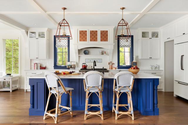 A blue and white kitchen for the family to eat, relax, and entertain.