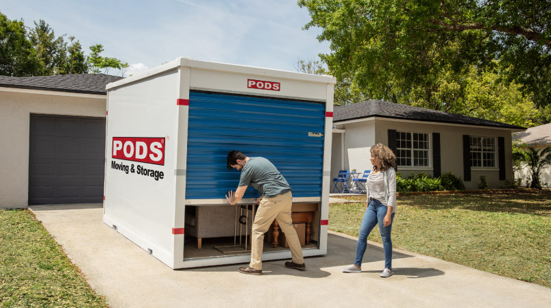 A couple storing their furniture in a PODS container