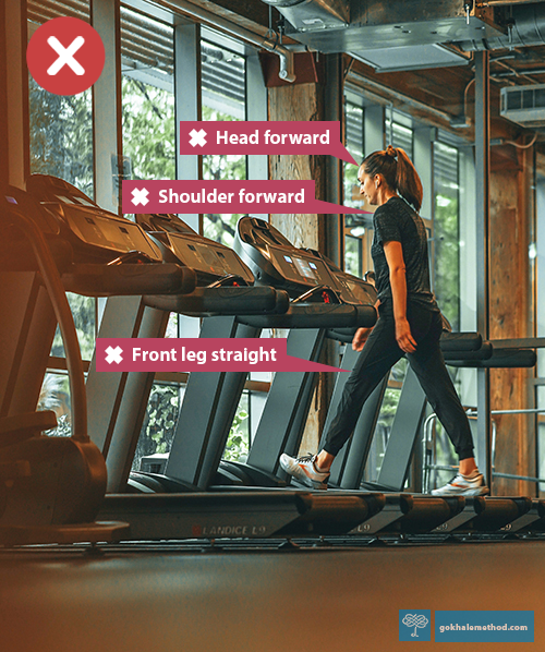 A row of contemporary treadmills with screens, with one female user