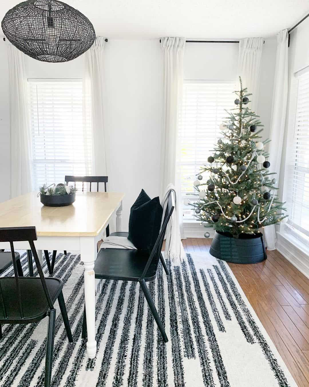 Dining room with white black Christmas tree