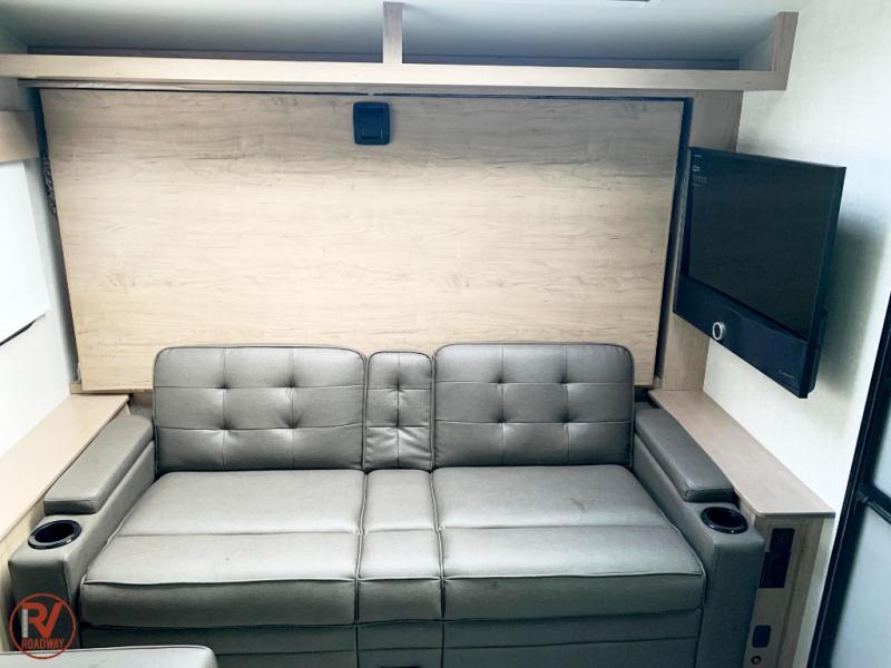 Murphy bed and sofa  in the Ember Overland Series travel trailer
