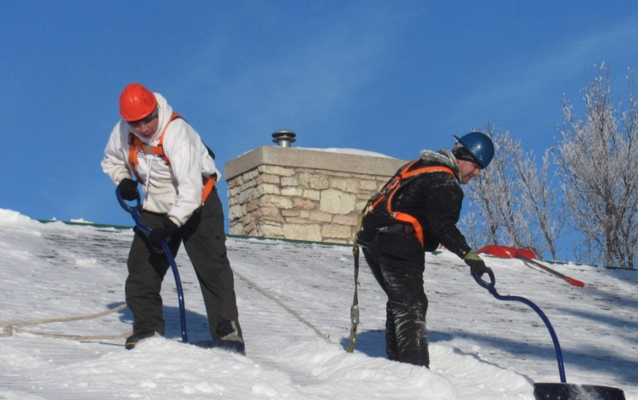 removing snow on roof to prevent ice dams