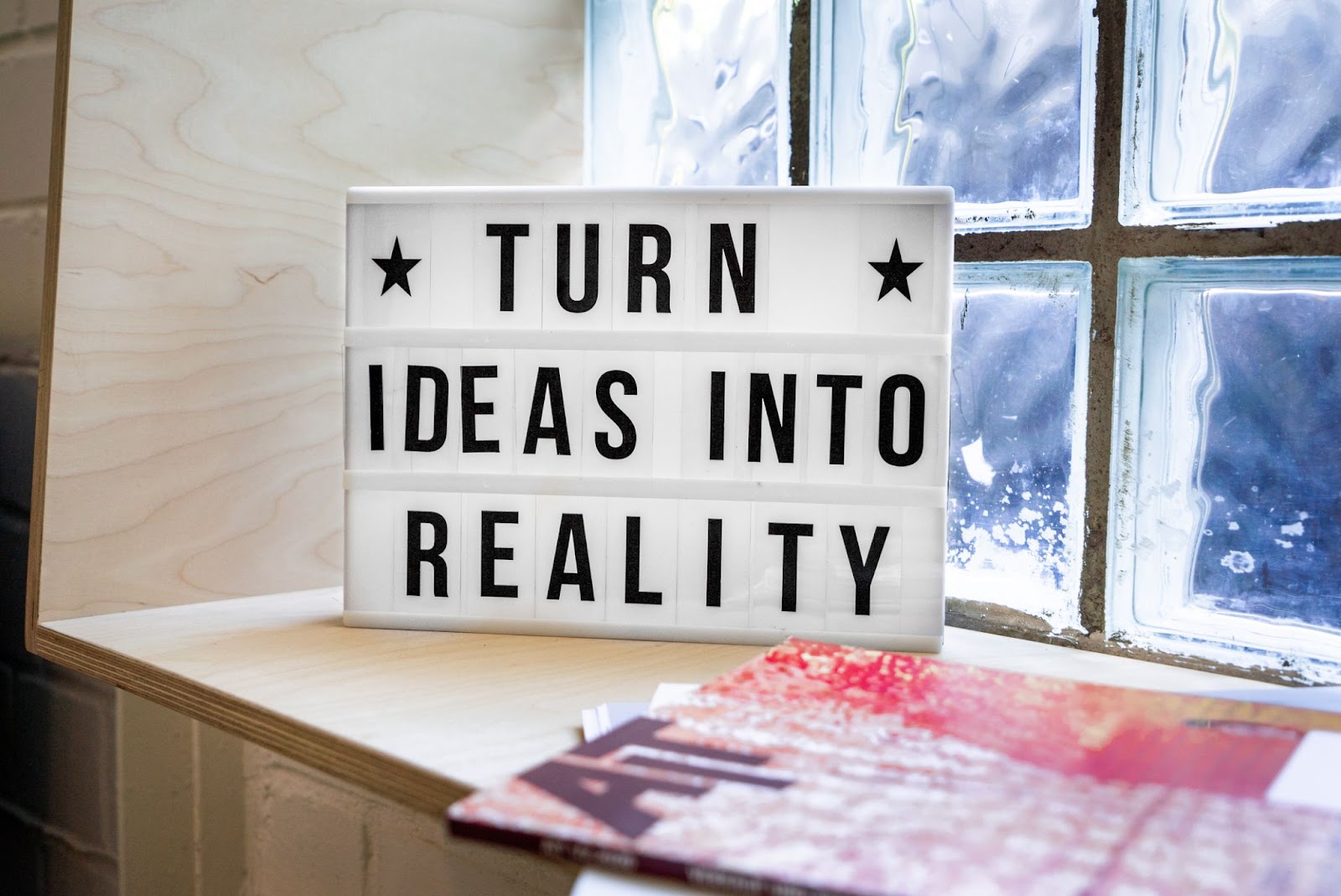 A sign which says Turn Ideas Into Reality