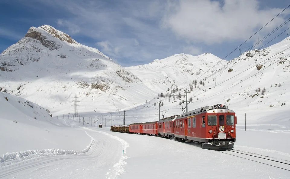 A train on tracks in the snow