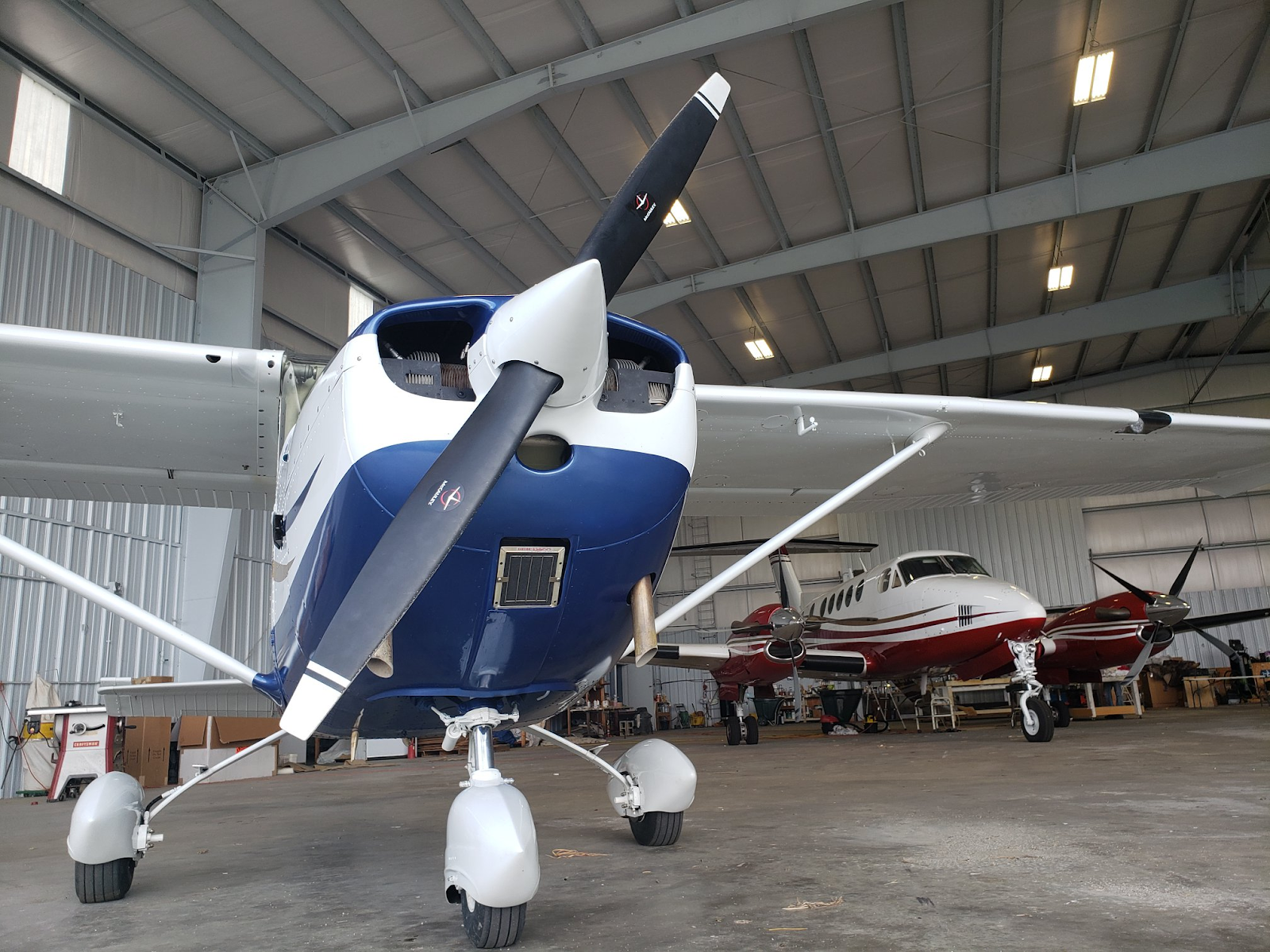 Two serviced airplanes parked in the Southern Air Customs hangar. Clay Lacy review