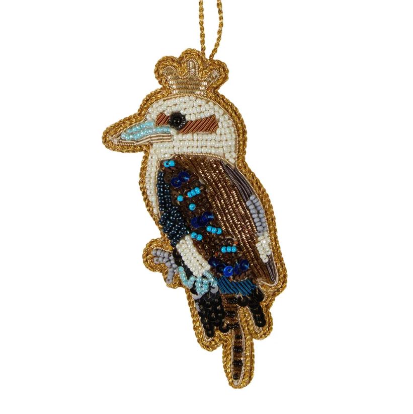 a beaded bird ornament hanging from a string