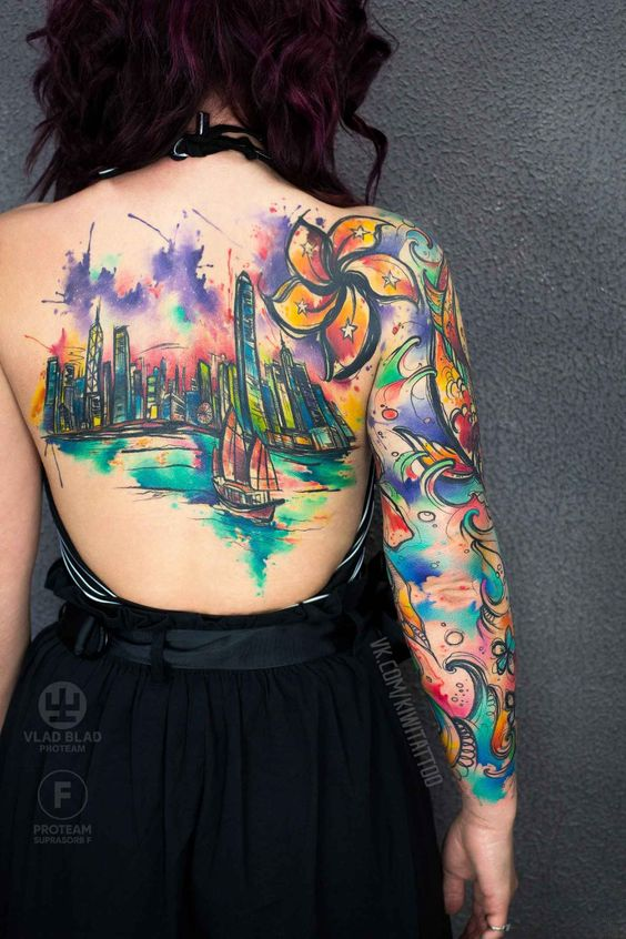 lady with colorful back and sleeve tattoo