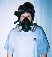 Son with asthma wears gas mask around smoking mother