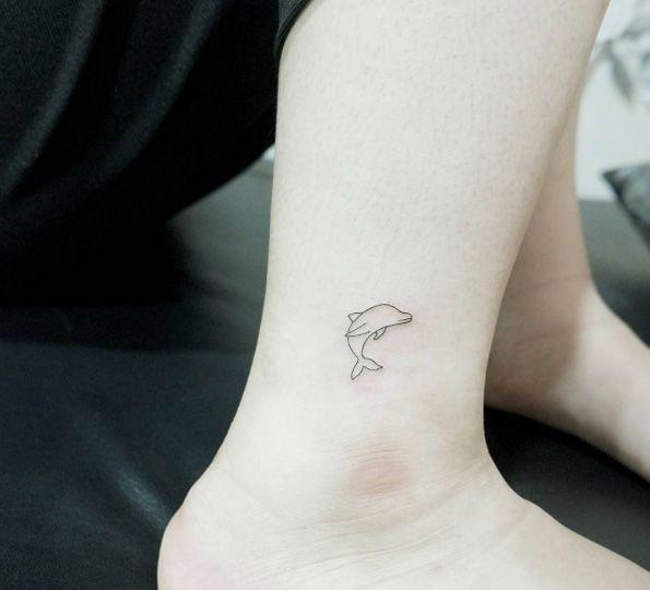 Dainty dolphin tattoo | Minimalist tattoo, Pattern tattoo, Dolphins tattoo