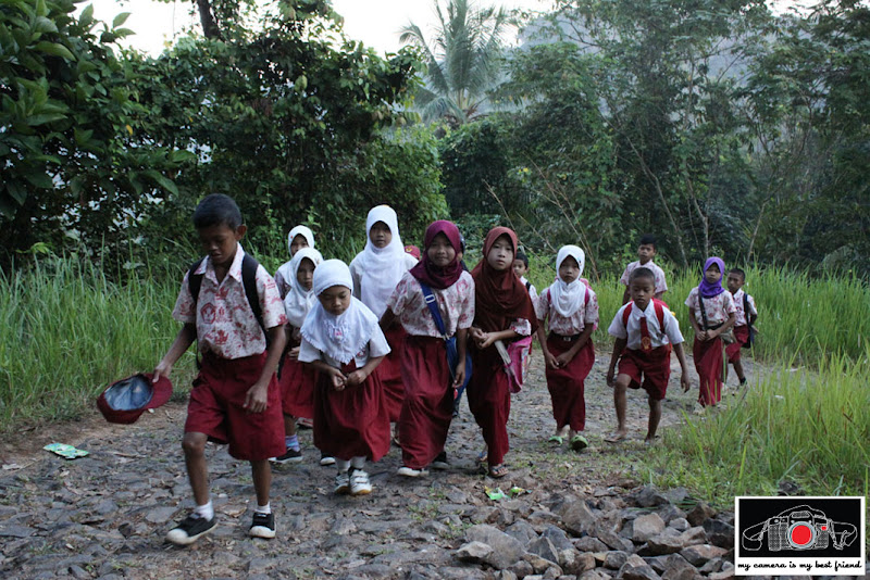 Children climbing another hill