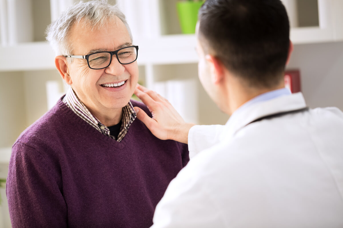 E prescribing software: doctor checking a senior man
