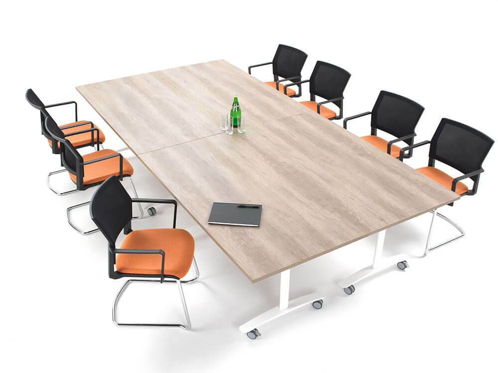 A flexible meeting room table with wheels.