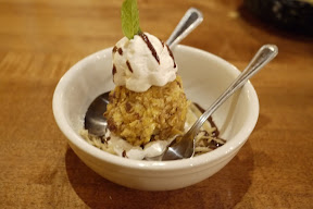bowl of mexican fried ice cream with two spoons