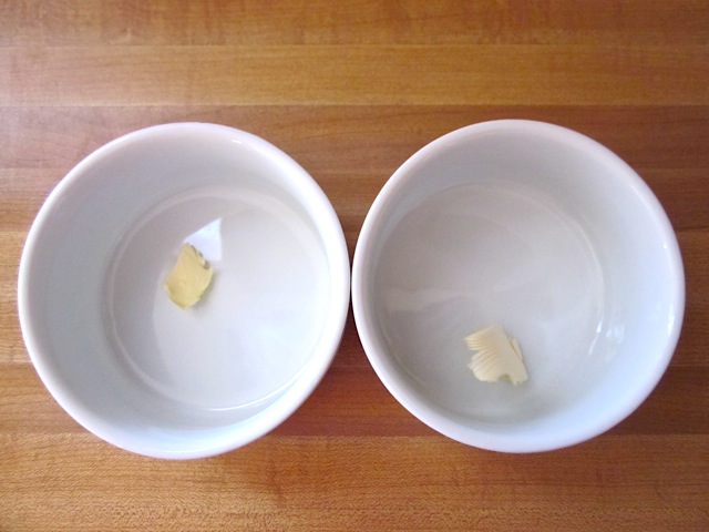 butter in bottom of ramekin (two side by side)