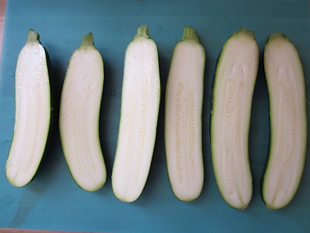 three zucchini cut in half 