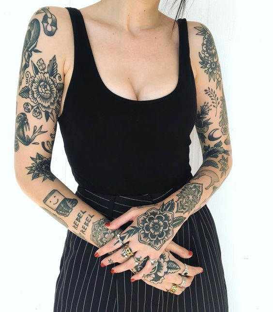 Another picture  showing a lady with her two arms tatted