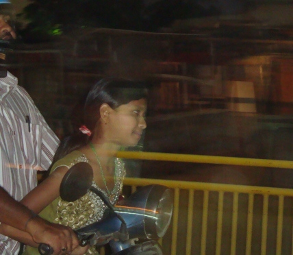 Indian girl on motorbike