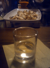 Tasting our perfect martini. In the background, the Crisp Potato Cakes with Goat Cheese and Thyme
