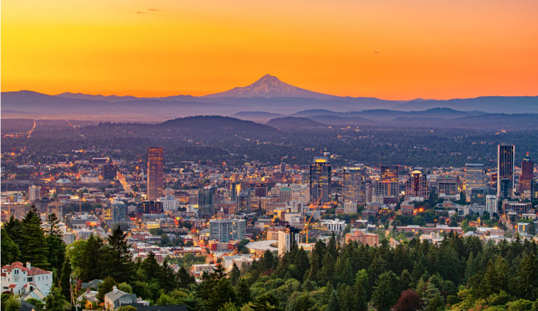 The City of Portland, Oregon, at dawn with Mt. Hood looming in the background. 