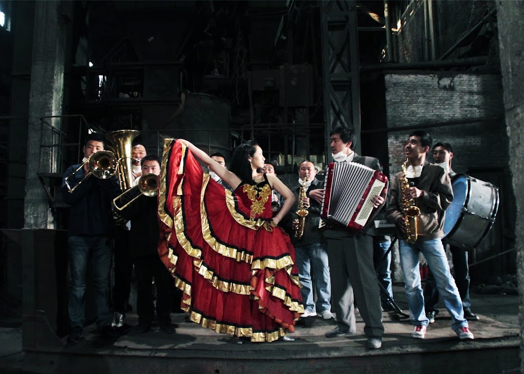 Chen (Wang Qian-yuan) and his band of factory workers perform in Zhang Meng's THE PIANO IN A FACTORY